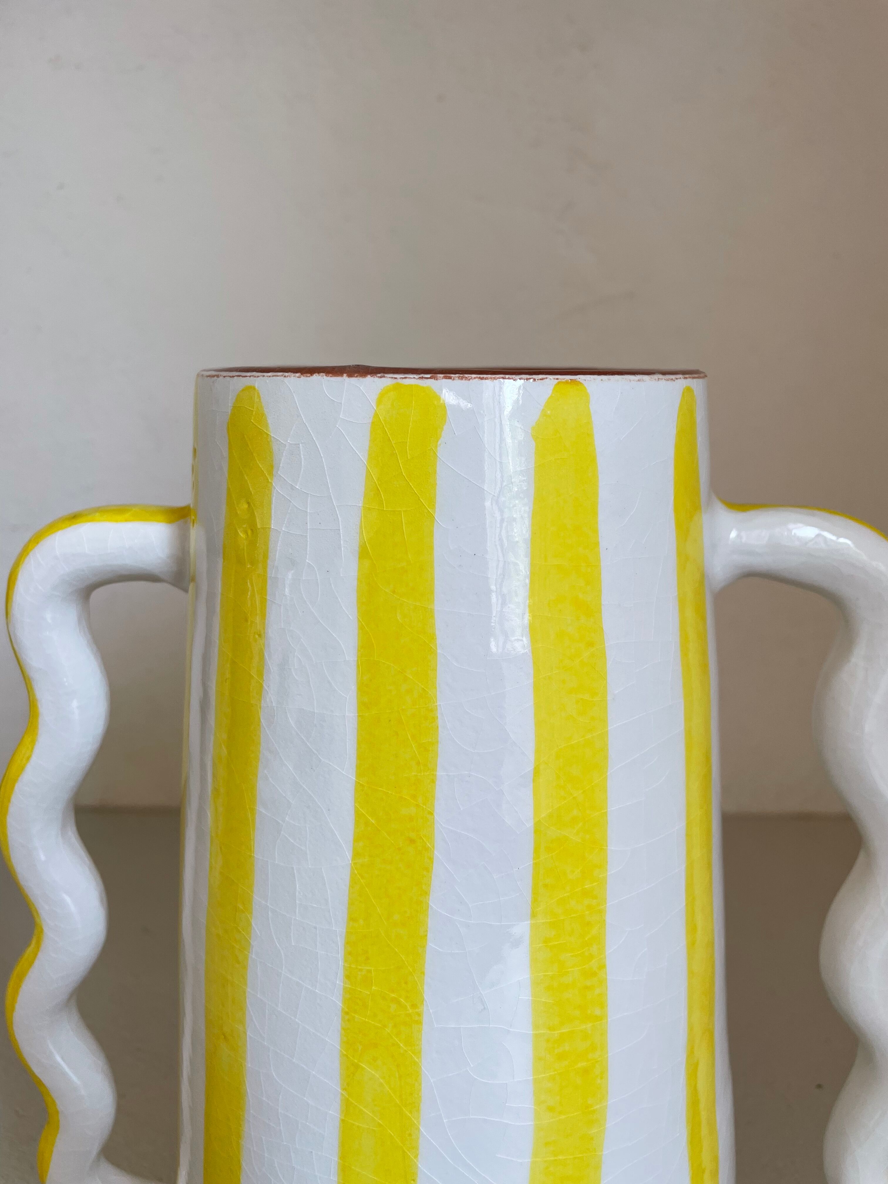 Lemon yellow and white striped ceramic vase with abstract wavy handmade handheld