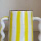 Lemon yellow and white striped ceramic vase with abstract wavy handmade handheld