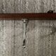 Wall coat rack from the 1950s-60s in solid oak and stainless steel.