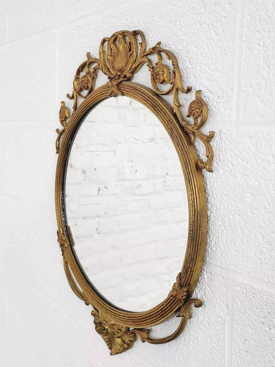 Round brass medallion style mirror