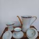 Coffee pot, sugar pot, 1 cup and saucer.