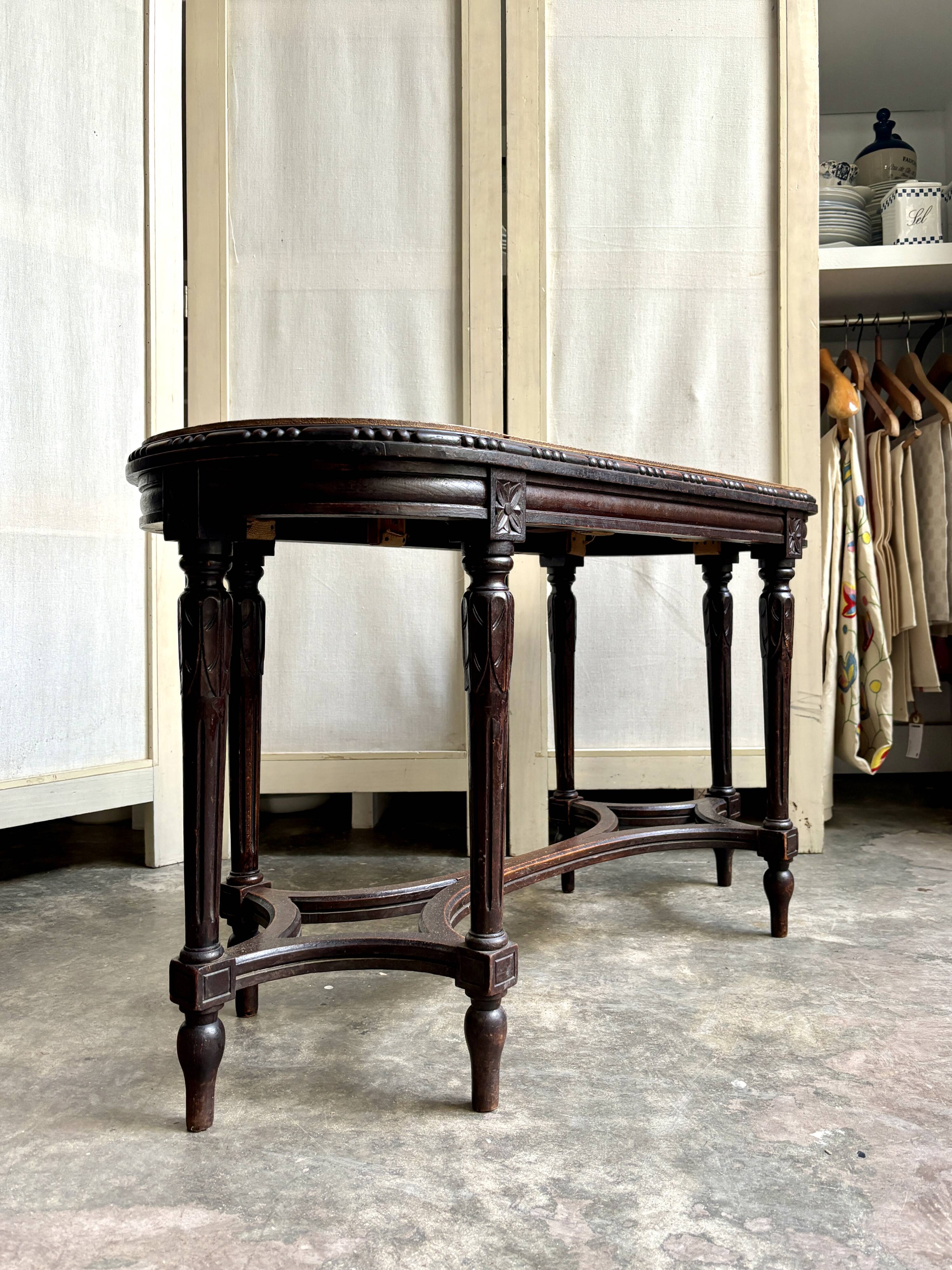 Dark wood piano bench