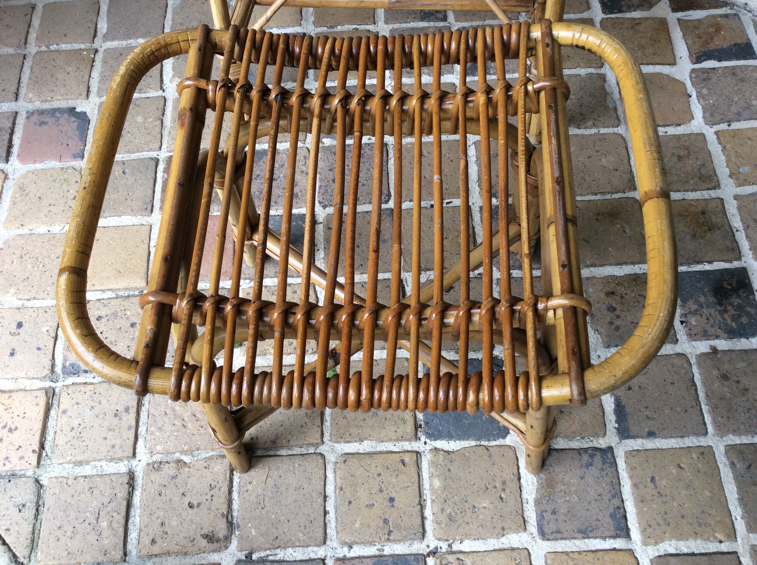 Rattan armchair and his feet rest