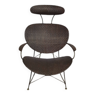 Armchair designed by Yuzuru Yamakawa  Metal frame.  Seat and back in braided rattan.