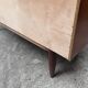 Teak sideboard with flap, 2 drawers and conical legs.