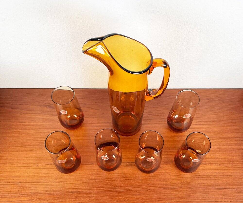 Amber glass carafe from the mid-century German Jagdhaus series and drinking glasses by Wilhelm Braun-Feldweg for Hirschberg, 1960s, set of 7.