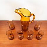 Amber glass carafe from the mid-century German Jagdhaus series and drinking glasses by Wilhelm Braun-Feldweg for Hirschberg, 1960s, set of 7.