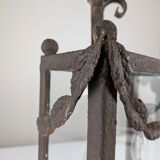 Wrought iron lantern with glass panels, leaf motifs
