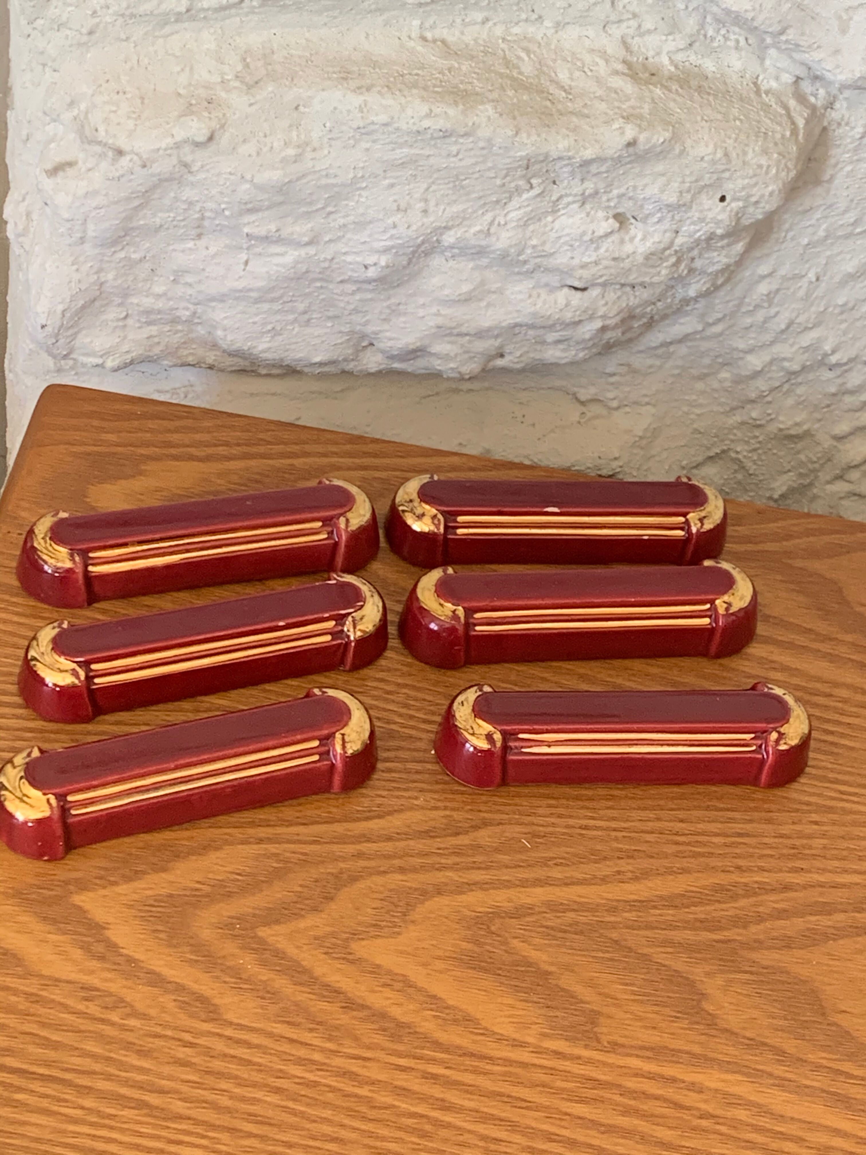 6 knife holders in burgundy glazed ceramic with art deco gold edging