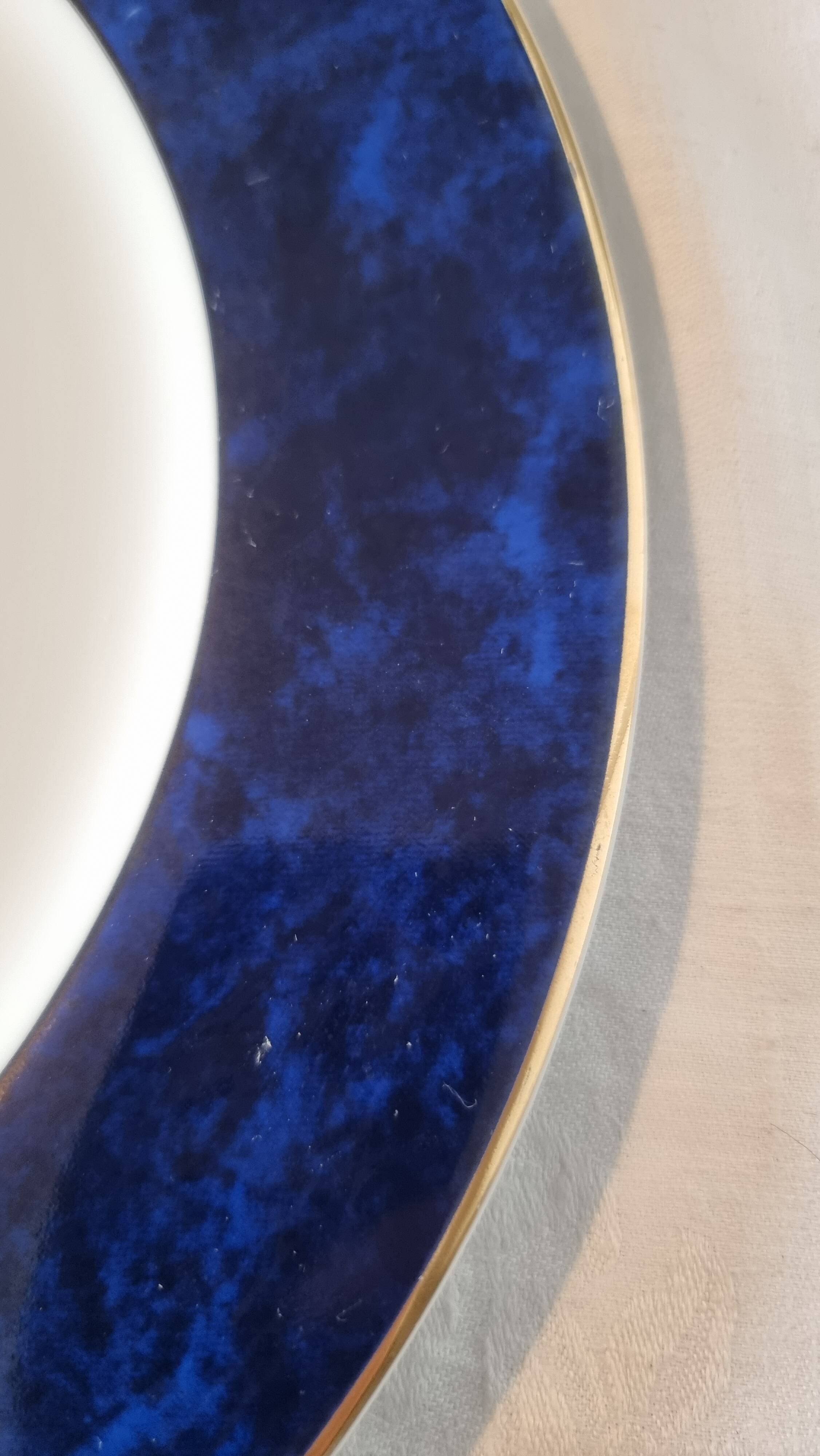 18-piece porcelain dinnerware set from Limoges by Philippe Deshoulières.