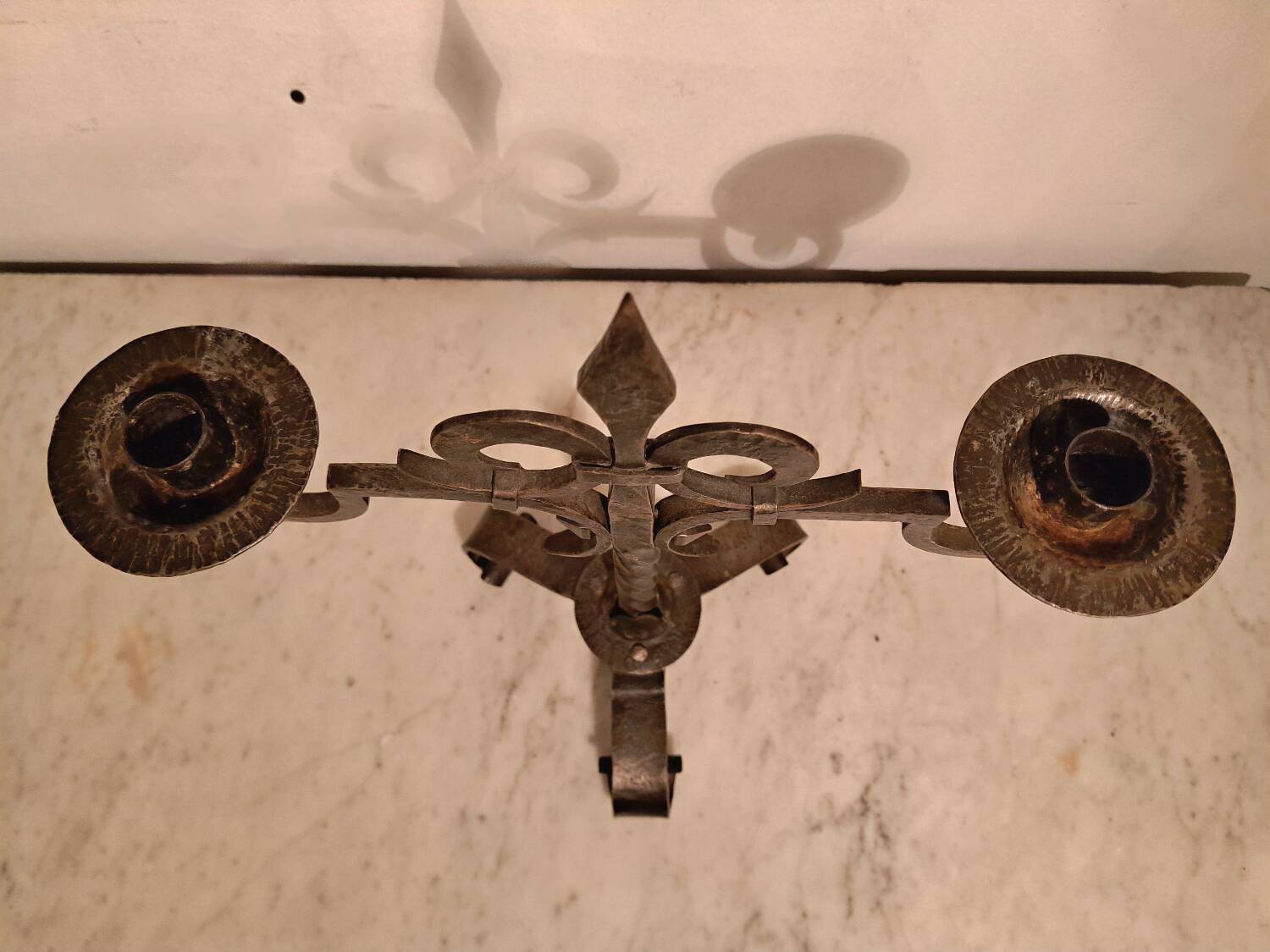 Black wrought iron fleur-de-lis candlestick