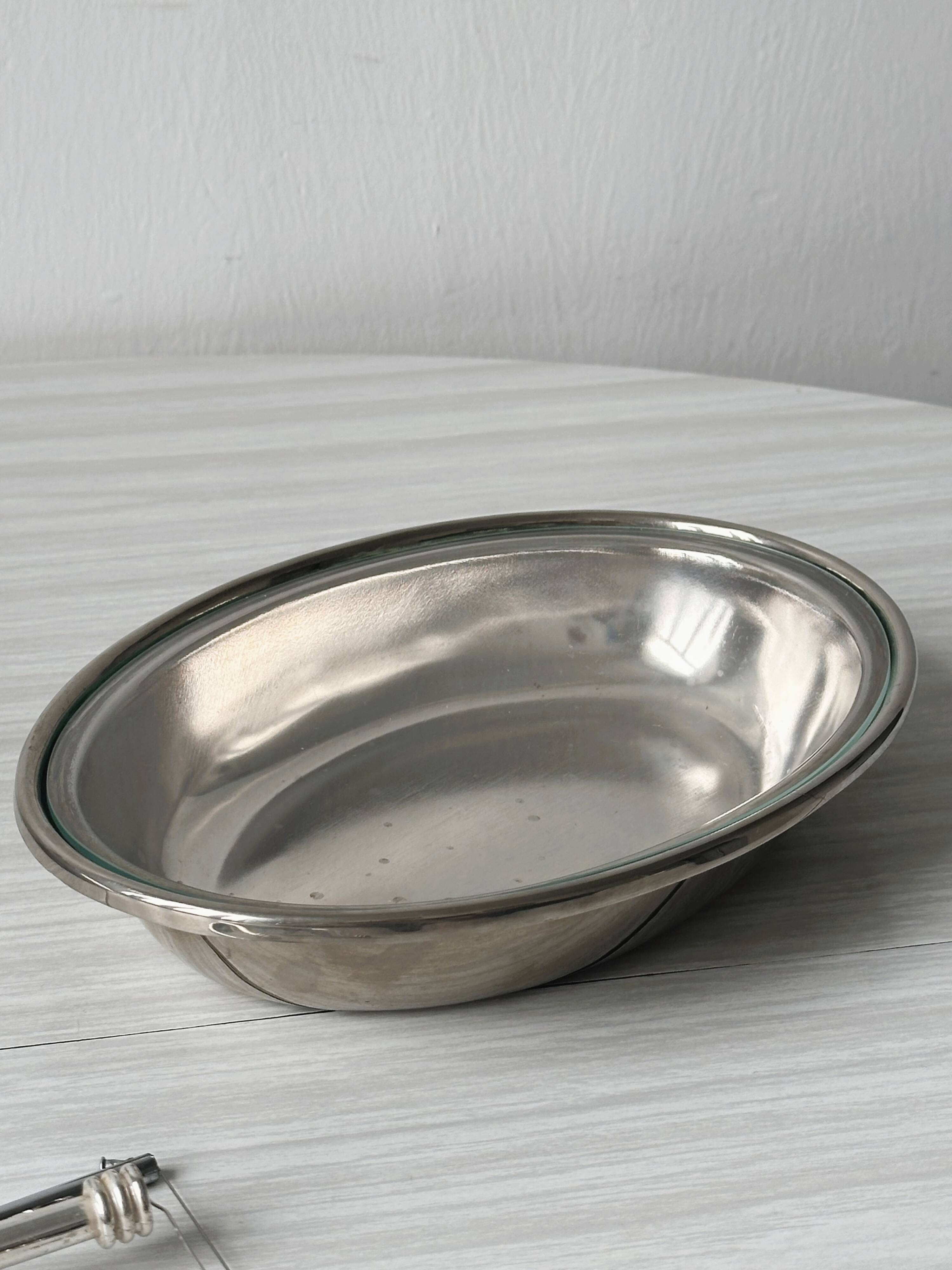 Foie gras display in stainless steel and silver metal.