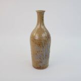 Brown ceramic/stoneware bottle with chiseled floral pattern