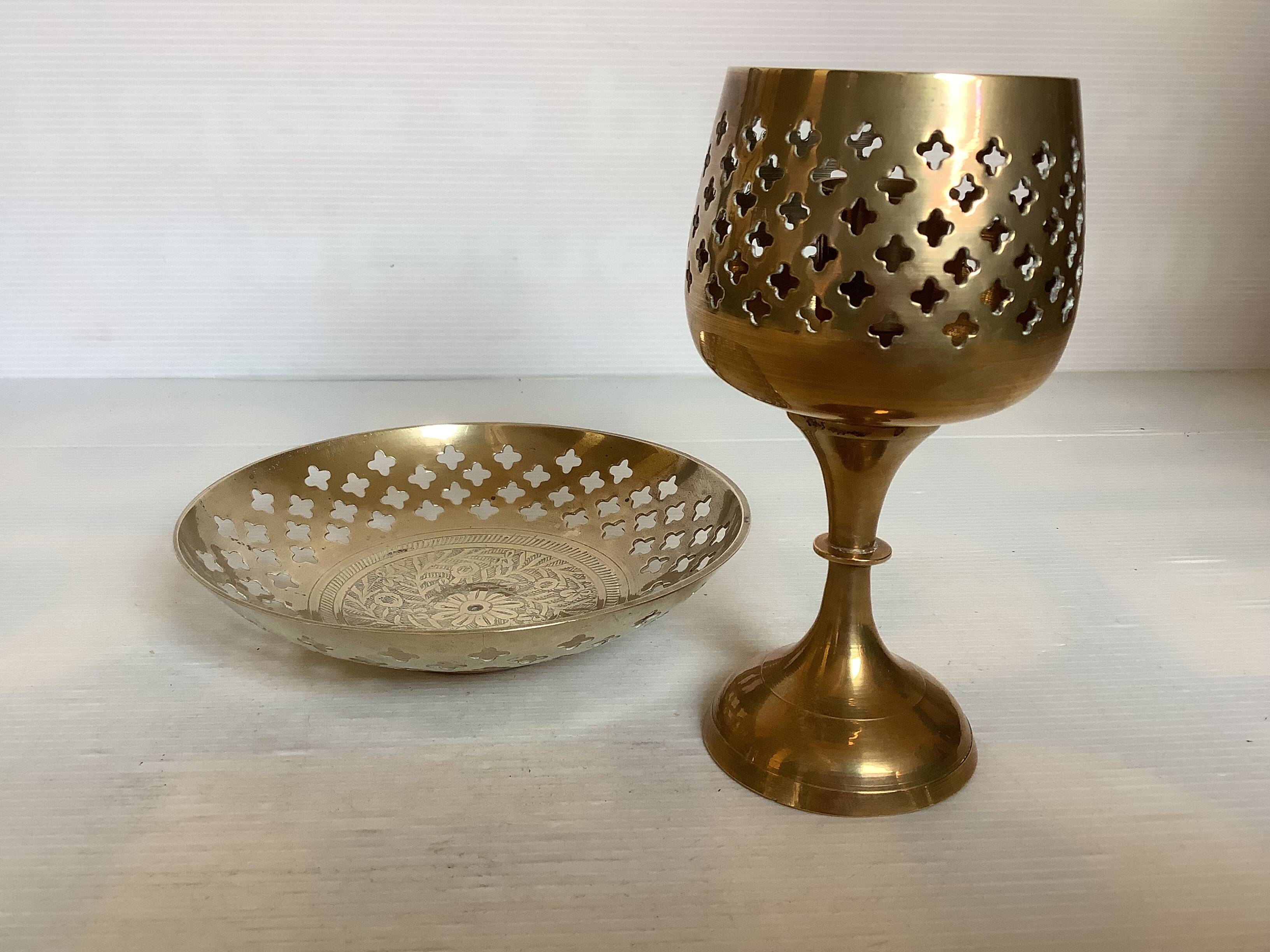 Lattice brass catchall and candlestick.