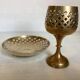 Lattice brass catchall and candlestick.