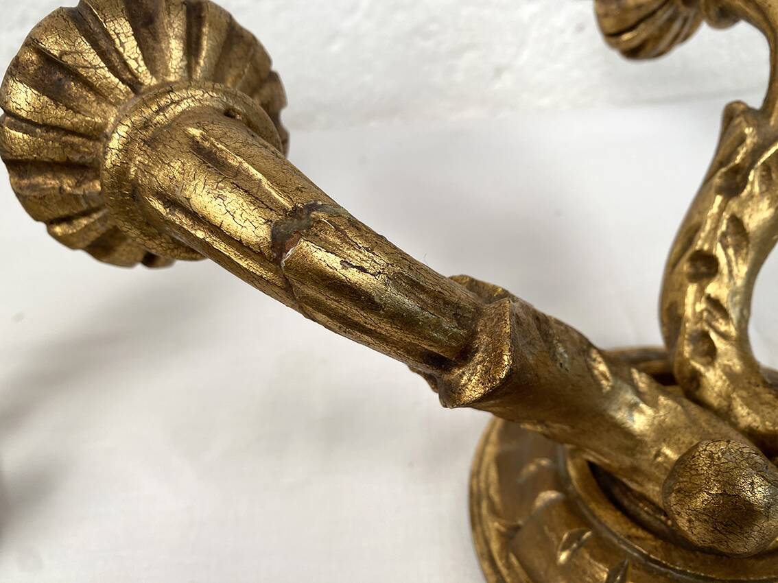 Pair of gilded wooden wall lights with two arms, early 20th century.