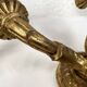 Pair of gilded wooden wall lights with two arms, early 20th century.