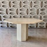 Light-colored octagonal travertine dining table