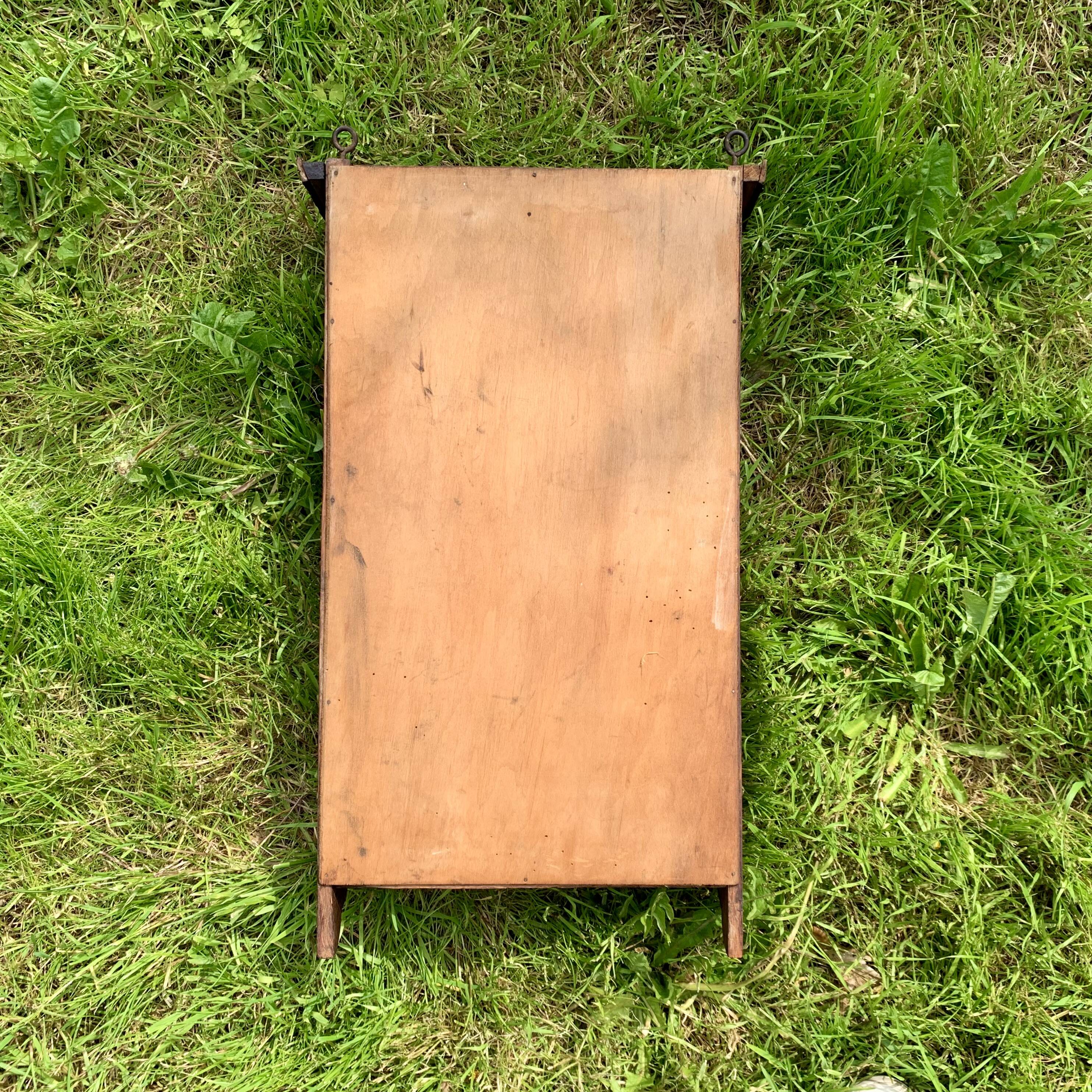 Old carved wooden medicine cabinet with beveled mirror