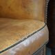 Set of 2 club armchairs in sheepskin leather with black piping