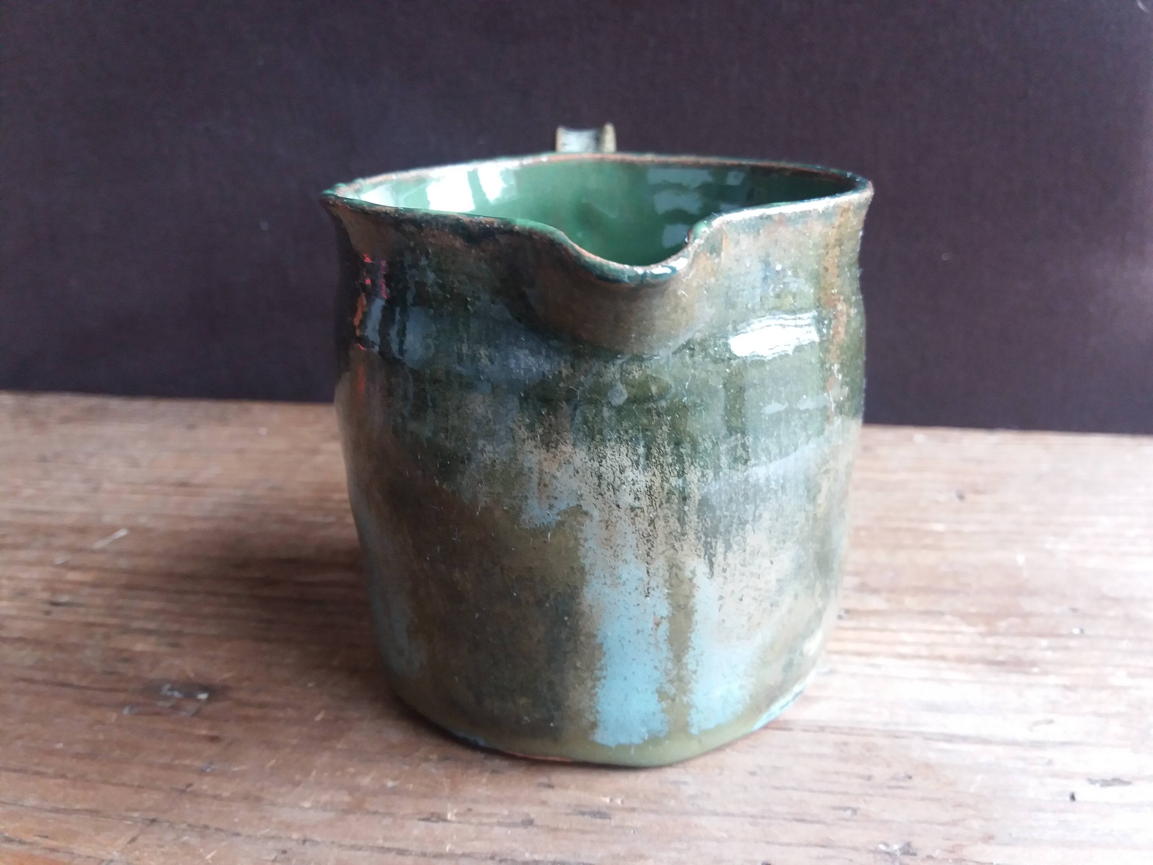 Handcrafted enameled terracotta pitcher signed