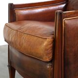 Comfortable Art Deco design armchair in cognac-colored sheepskin combined with wood