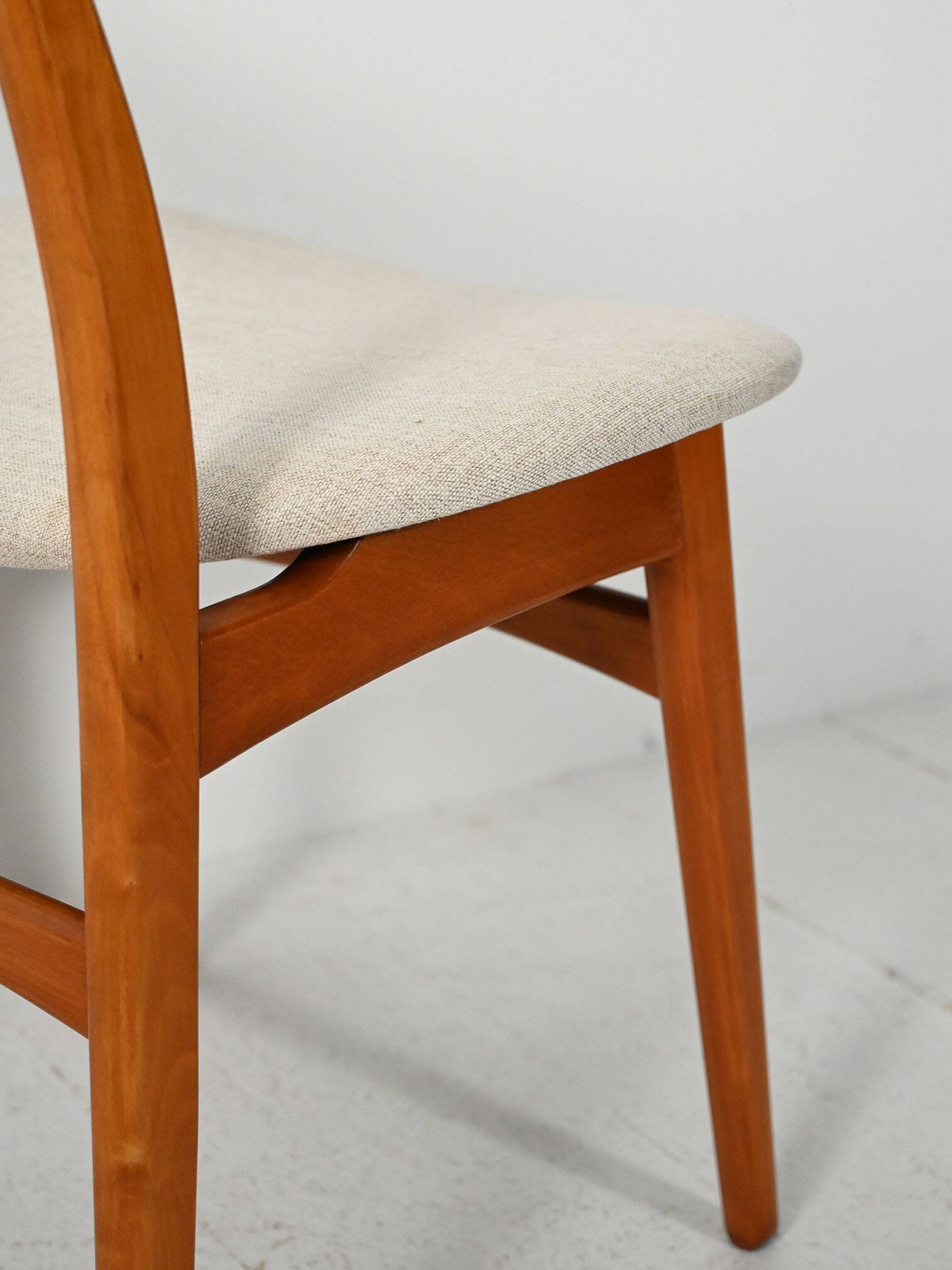 Pair of vintage teak chairs with a curved backrest