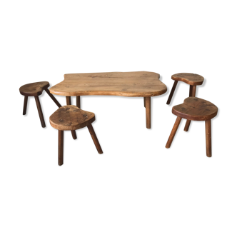 Brutalist style coffee table in solid elm accompanied by 4 tripod stools. Year's work