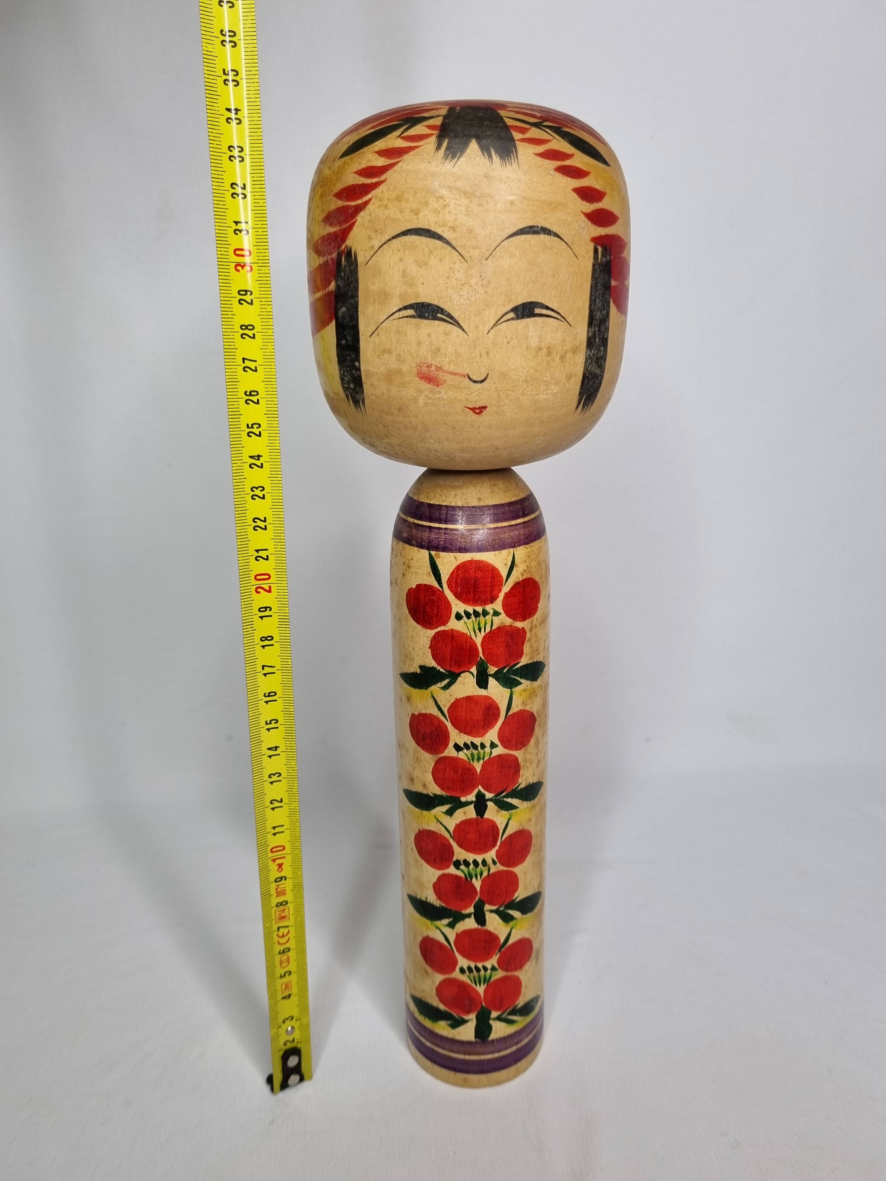 Vintage Japanese Kokeshi doll dated 1986, signed and numbered, floral decoration, 34 cm