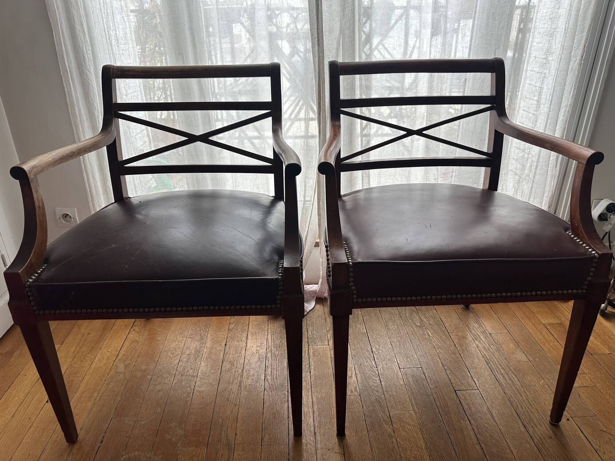 Pair of leather and wood bridge armchairs – Directoire style, 1940s