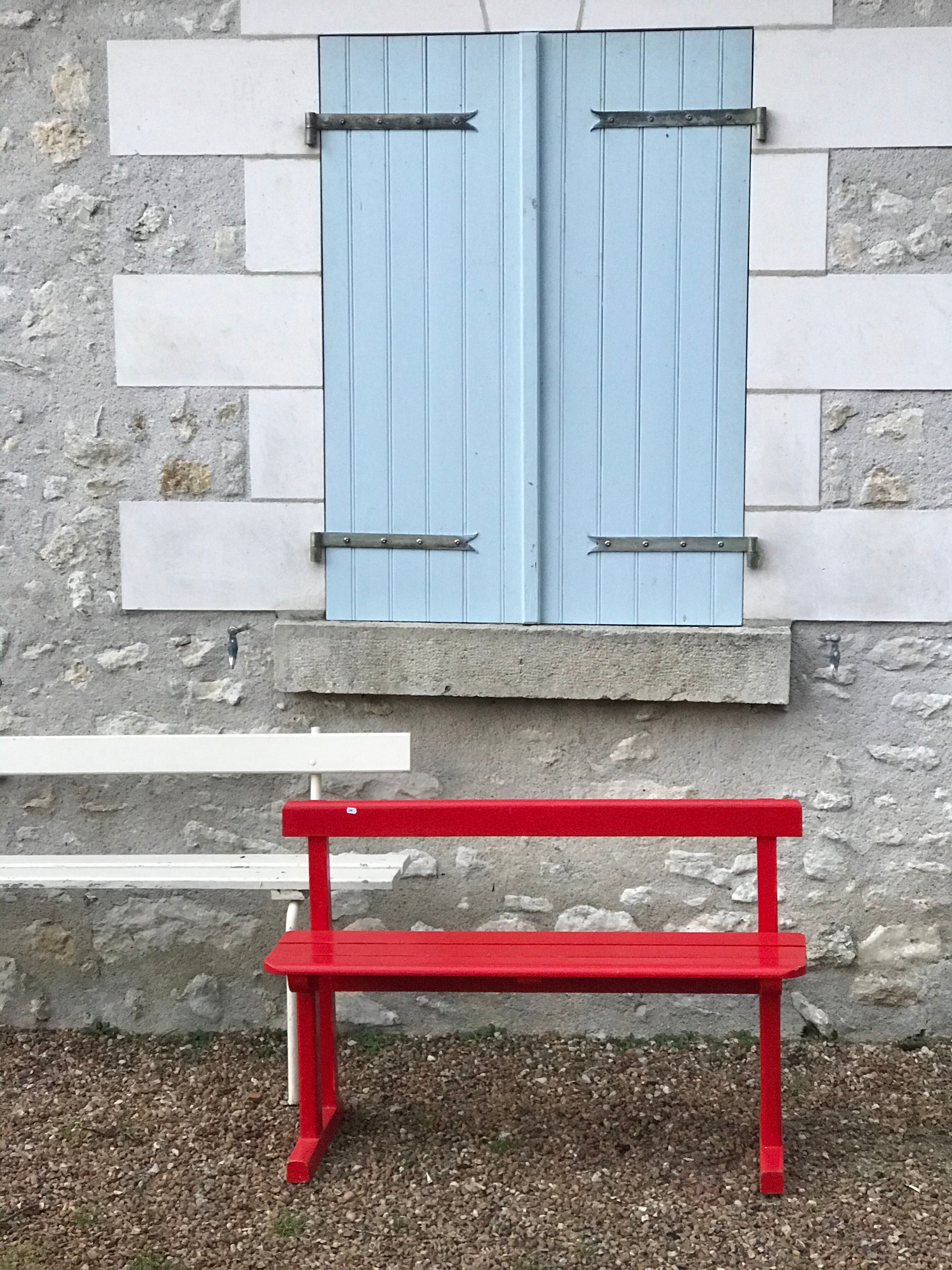 Red old schoolboy bench