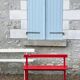 Red old schoolboy bench