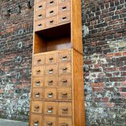 Large vintage workshop furniture with 30 drawers, antique haberdashery compartments.