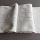 Old linen sheet embroidered with ecru-beige colors with monogram