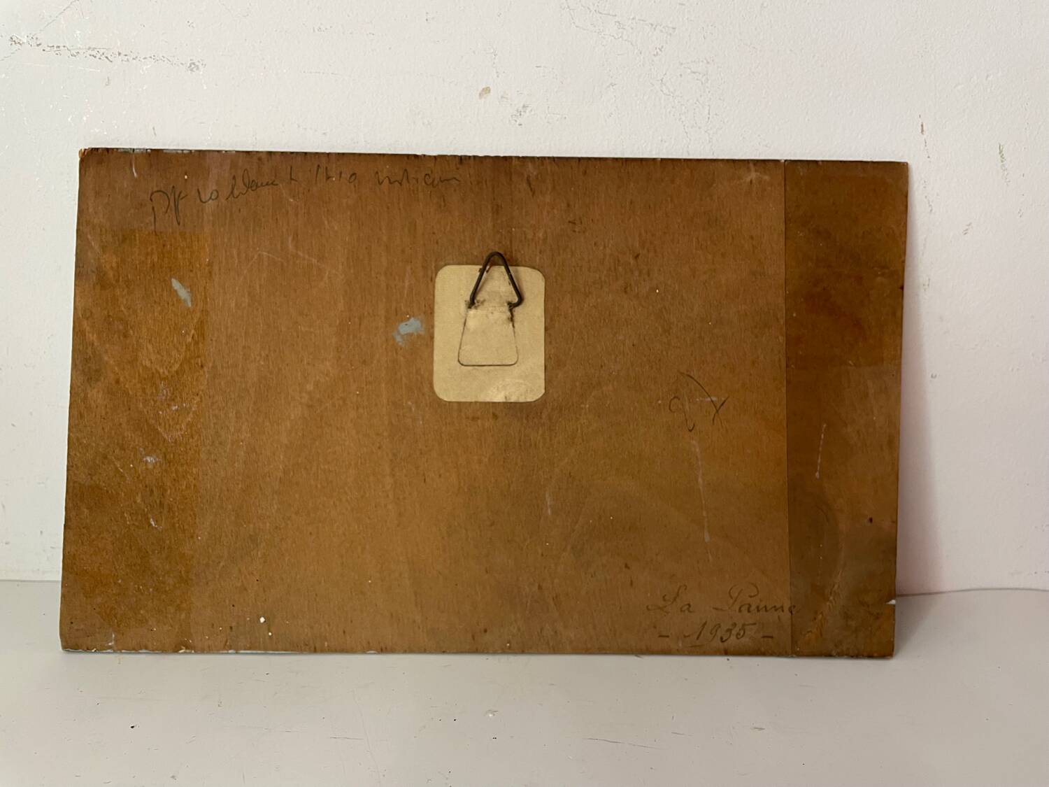 A pair of old paintings on wood.