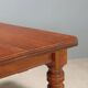 Antique extendable mahogany table with a crank mechanism, United Kingdom.