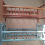 2 beds of old wooden dolls superimposed