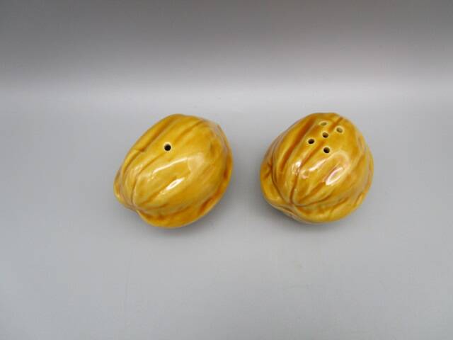 Pair of old earthenware salt/pepper shakers in “walnut” shape