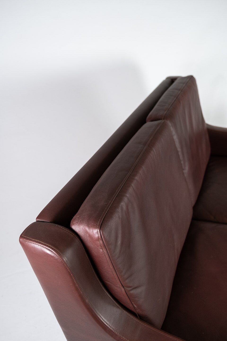 Two seater sofa, with red brown leather by Stouby Furniture