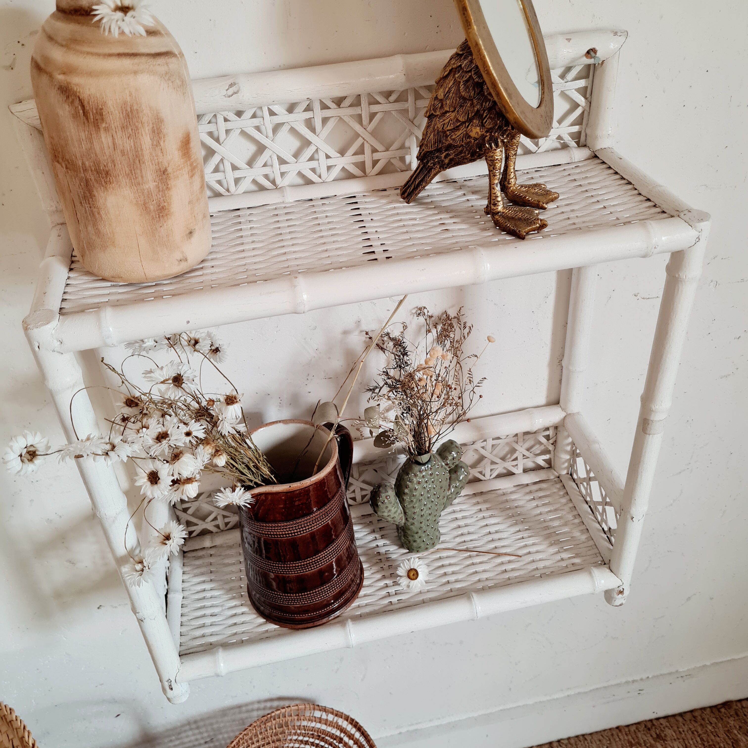 Vintage rattan and bamboo shelves painted white