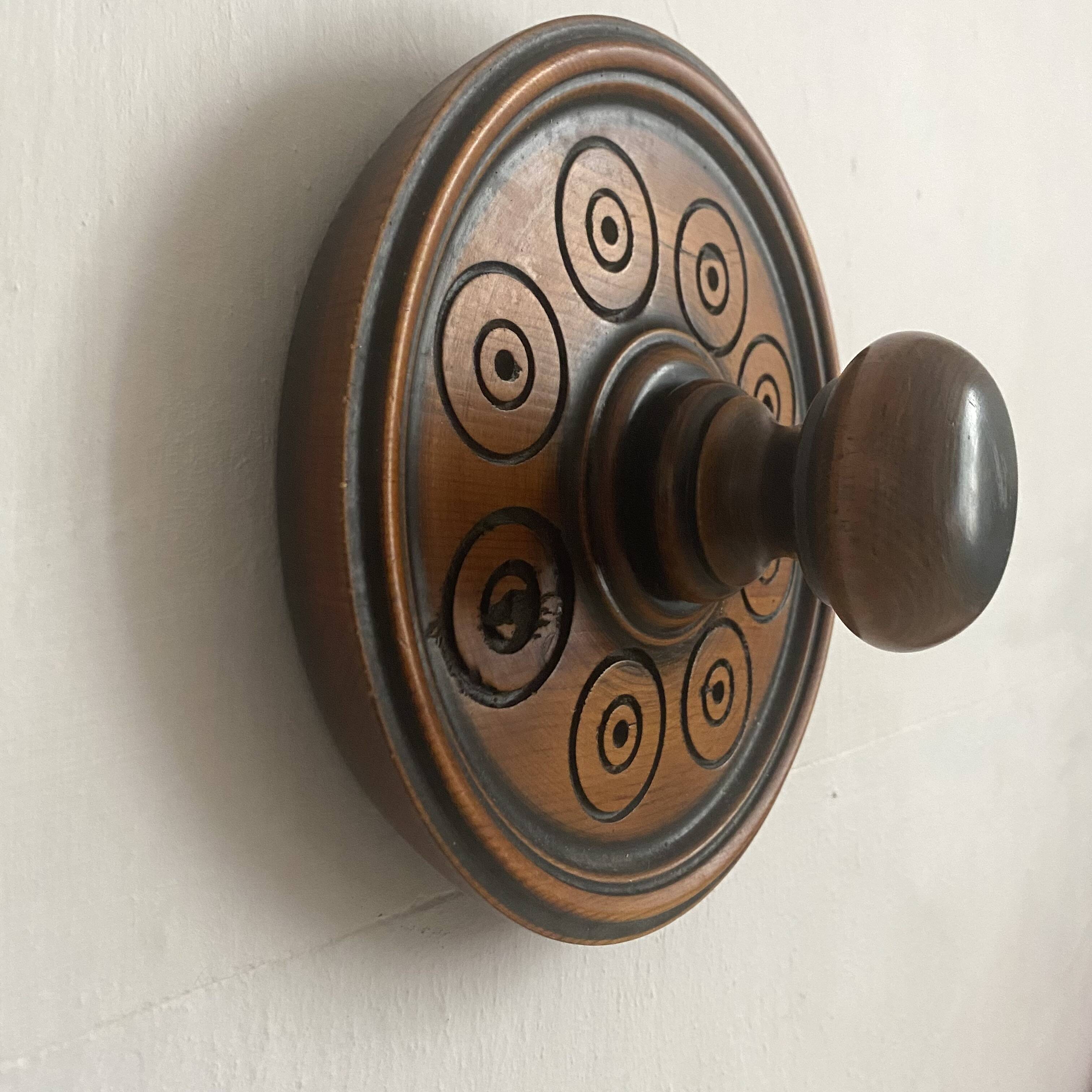 Pair of carved wooden wall hooks