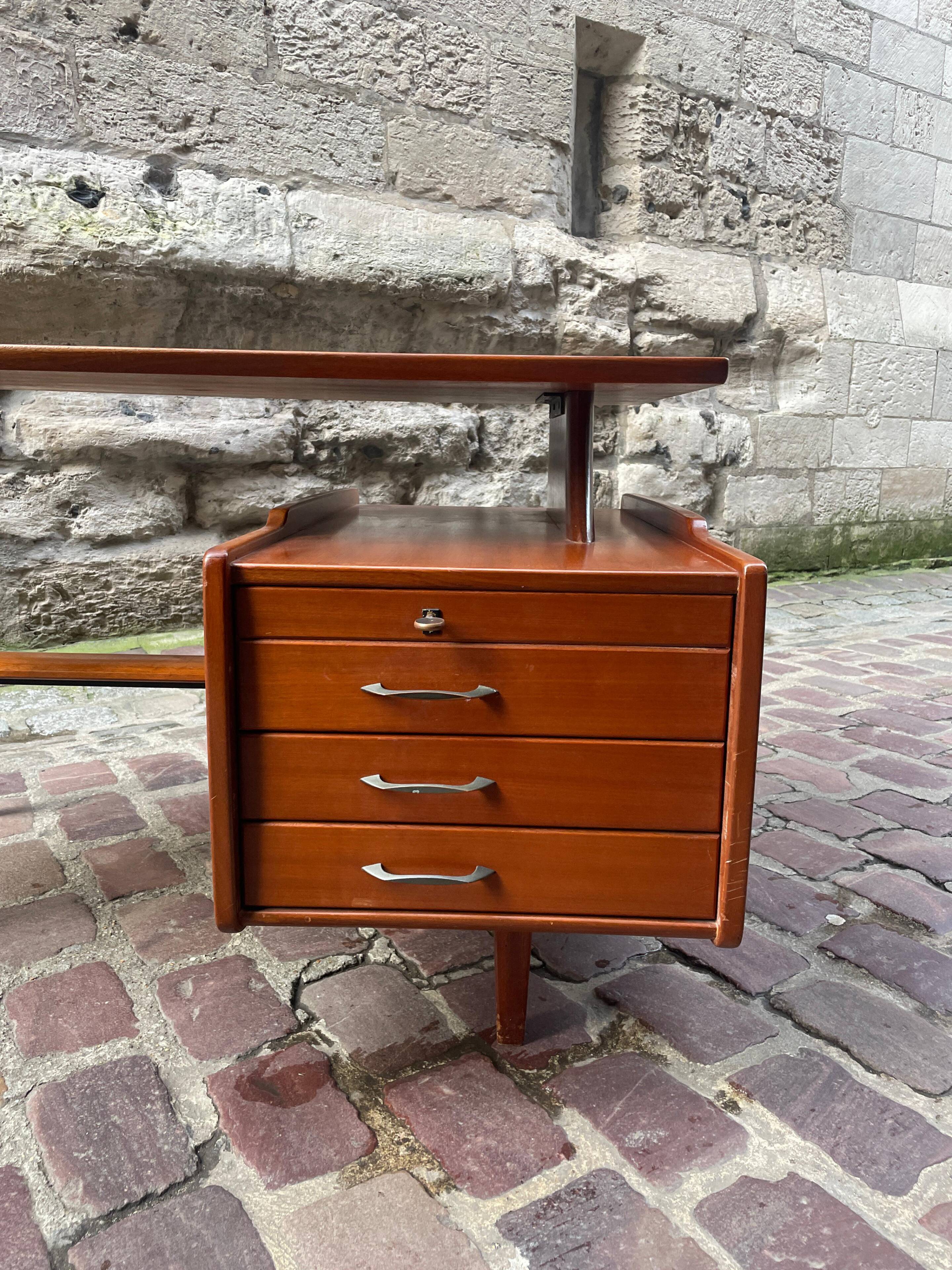 Mahogany desk with drawers by Jacques Hauville published by Bema.
