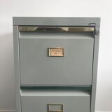 Three-drawer industrial grey metal filing cabinet with hanging backs