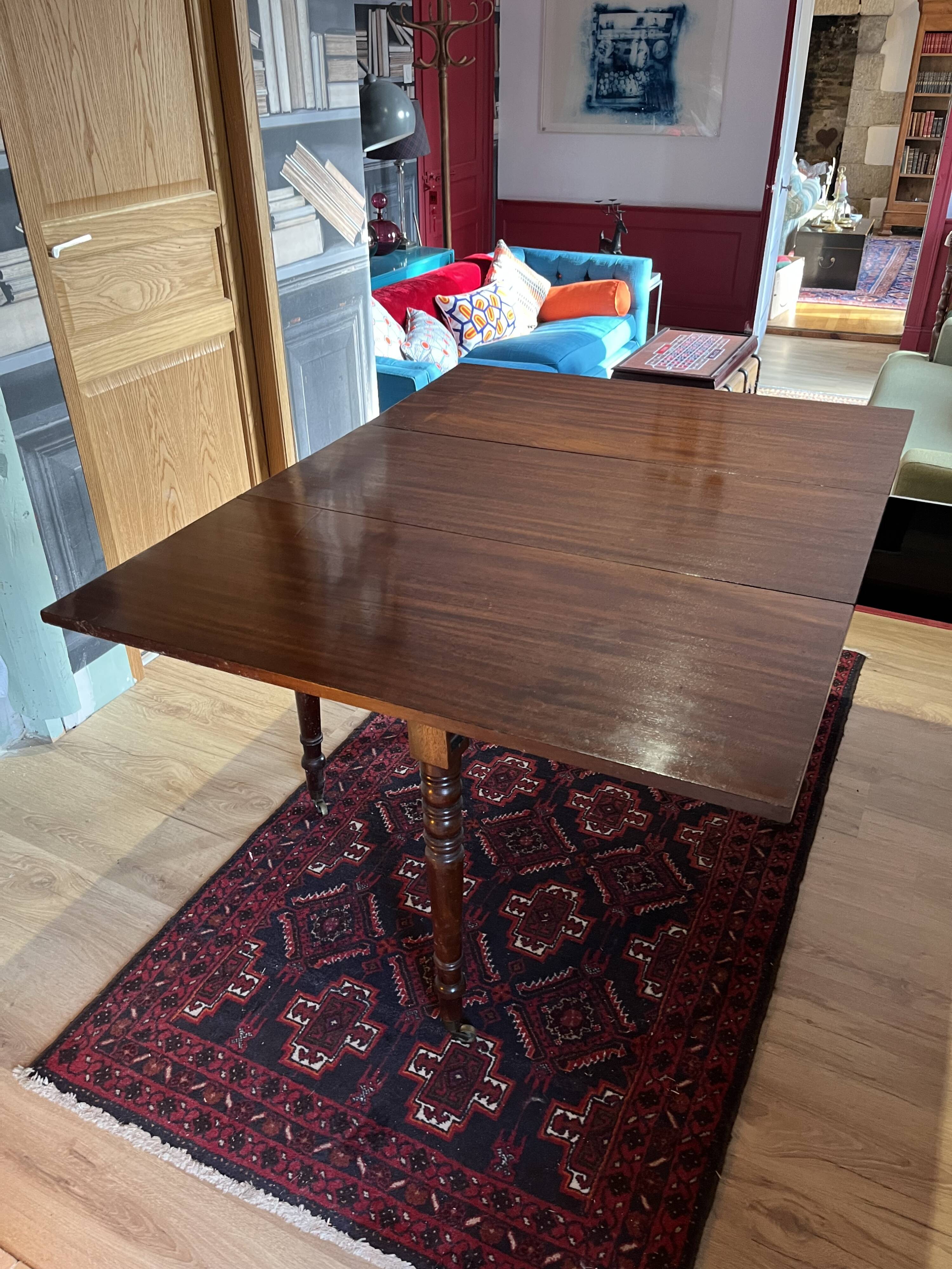 Vintage drop-leaf mahogany table; ideal for decorators.