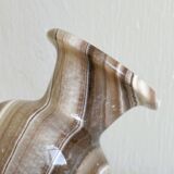 Natural stone vase with marbled patterns.
