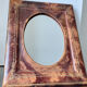 Antique leather framed mirror with gildings 30 cm x  24 cm