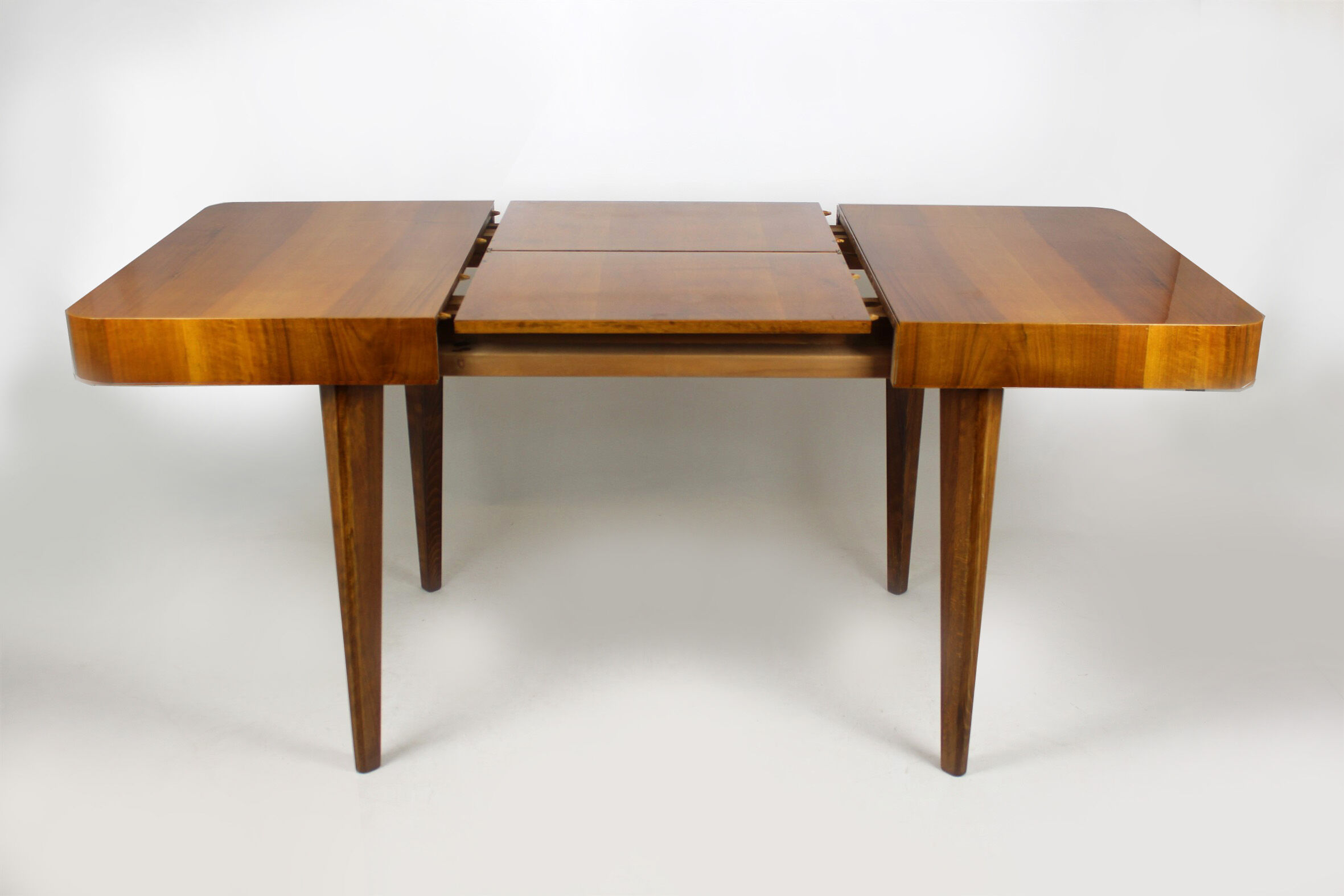 Walnut folding dining table by Jindrich Halabala for UP Zavody, 1940s