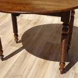 Antique walnut table with drop-leaf doors