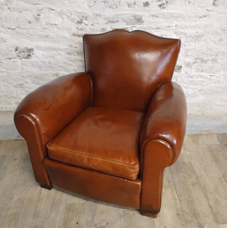 Club chair with a moustache backrest