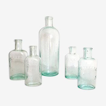 Set of small old glass bottles